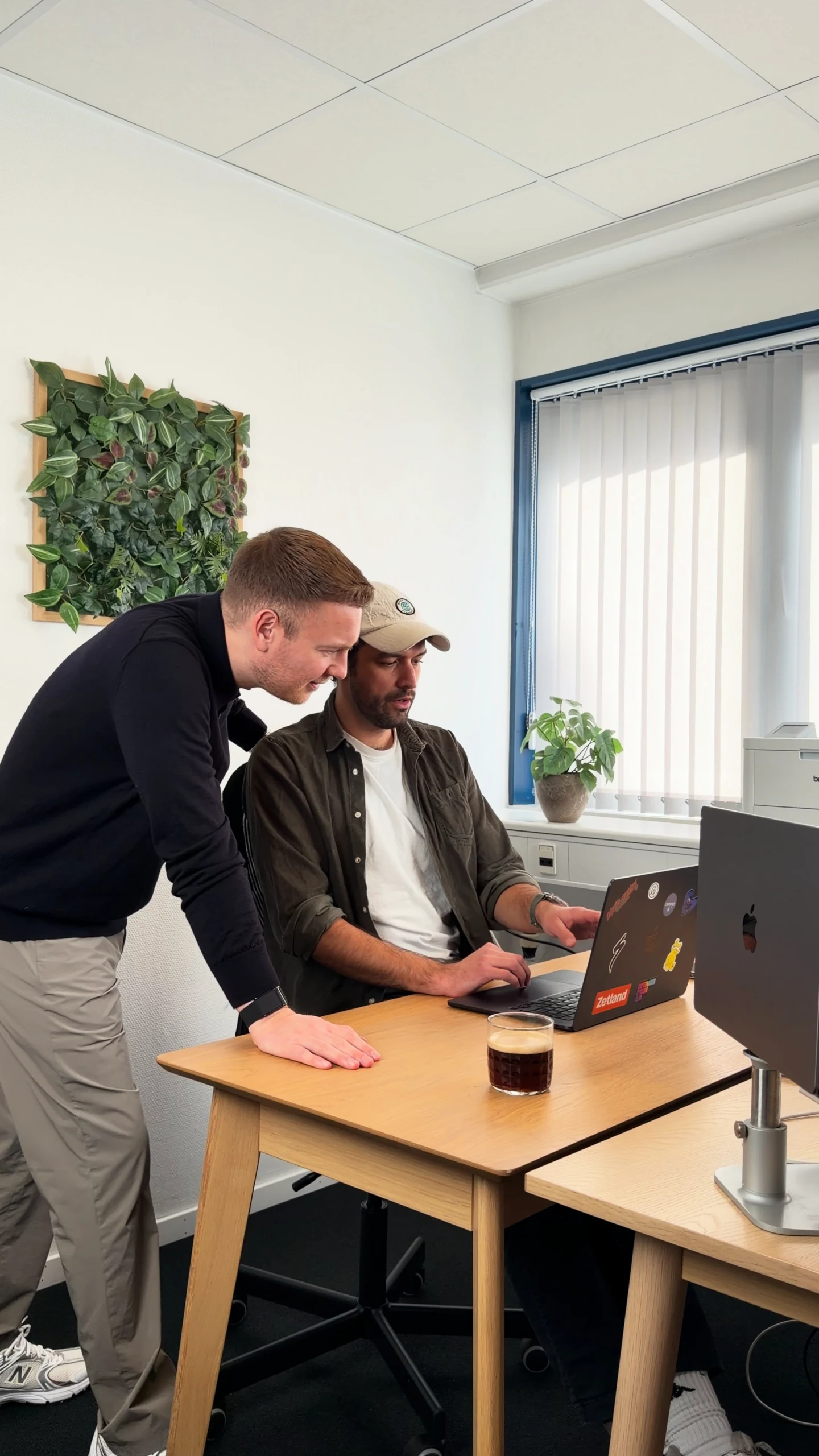 Two B3H specialists working together at a computer